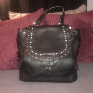 Unique Michael Kors pebbled leather black backpack